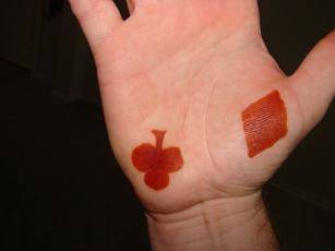 Henna tattoo of clover on palm